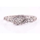 A diamond set white metal bracelet with approximately 1.30ct in various round brilliant cuts, 8-cuts