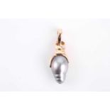 A baroque cultured black pearl and diamond pendant set in yellow metal stamped 585, 14KT, the