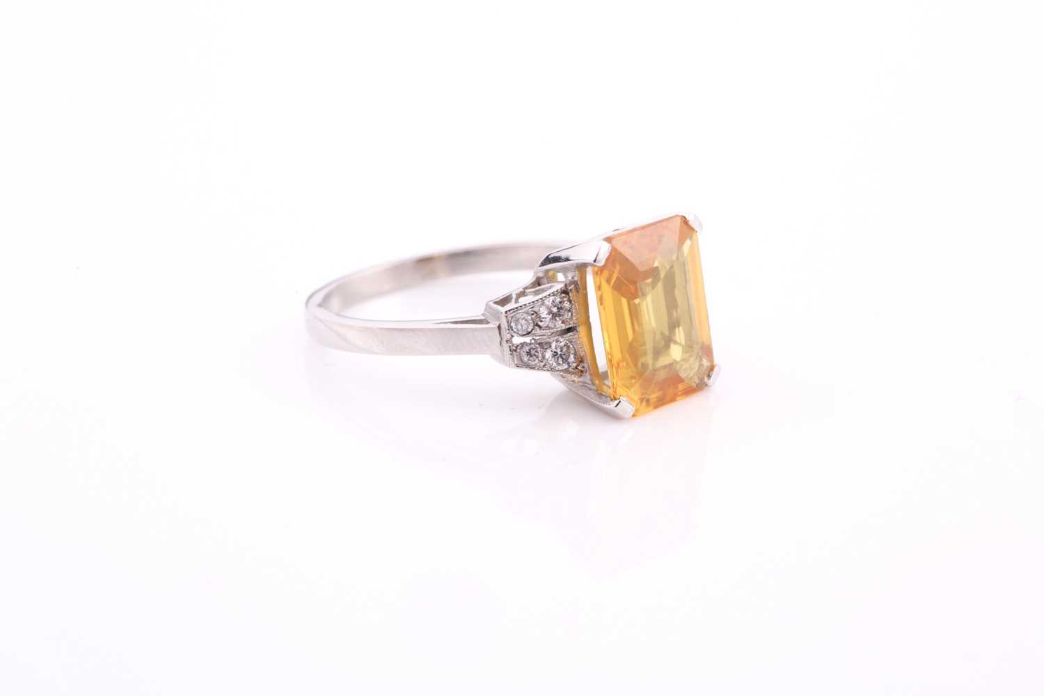 A yellow sapphire and diamond ring, the 10.5x8mm yellow sapphire with an estimated weight of 3.20ct, - Image 4 of 4