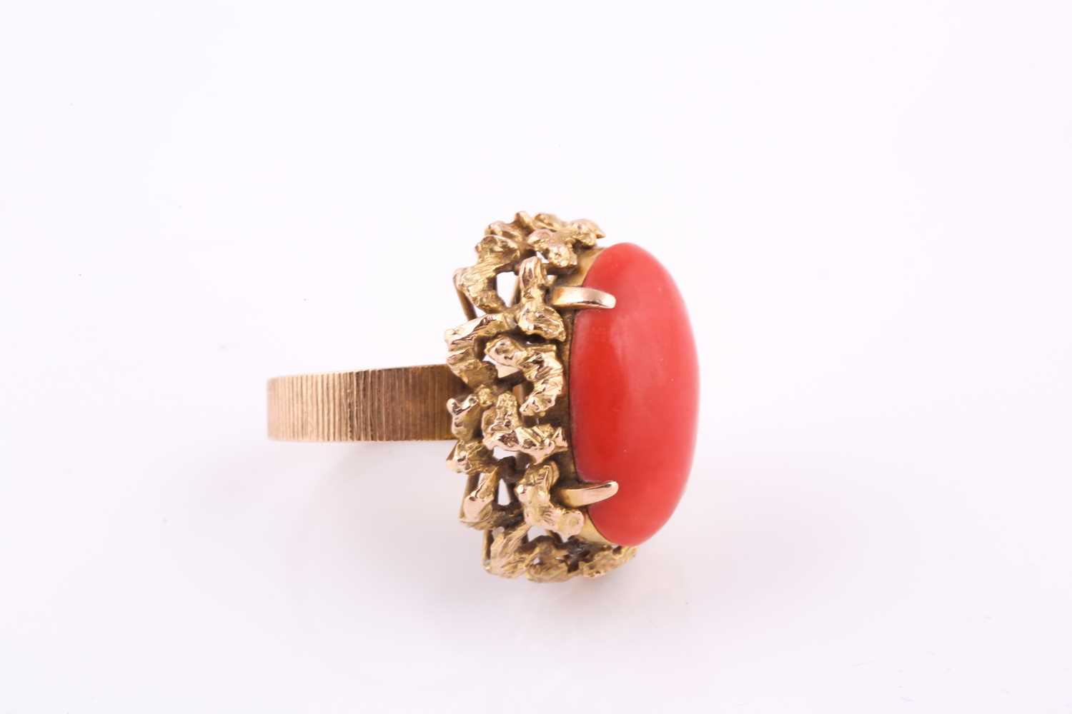 A 1970’s Continental gold and coral cabochon ring, the oval cabochon approximately 21.5mm x 13mm, - Image 3 of 4