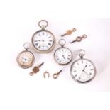 A lot consisting of four pockets watches and keys, the first silver Victorian 53mm watch with a