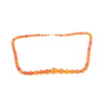 A long faceted amber bead necklace, the graduated beads measuring from 2 cm to 5mm diameter, with