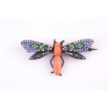 A Continental silver carved coral and enamel dragonfly brooch, the body finely carved coral, with