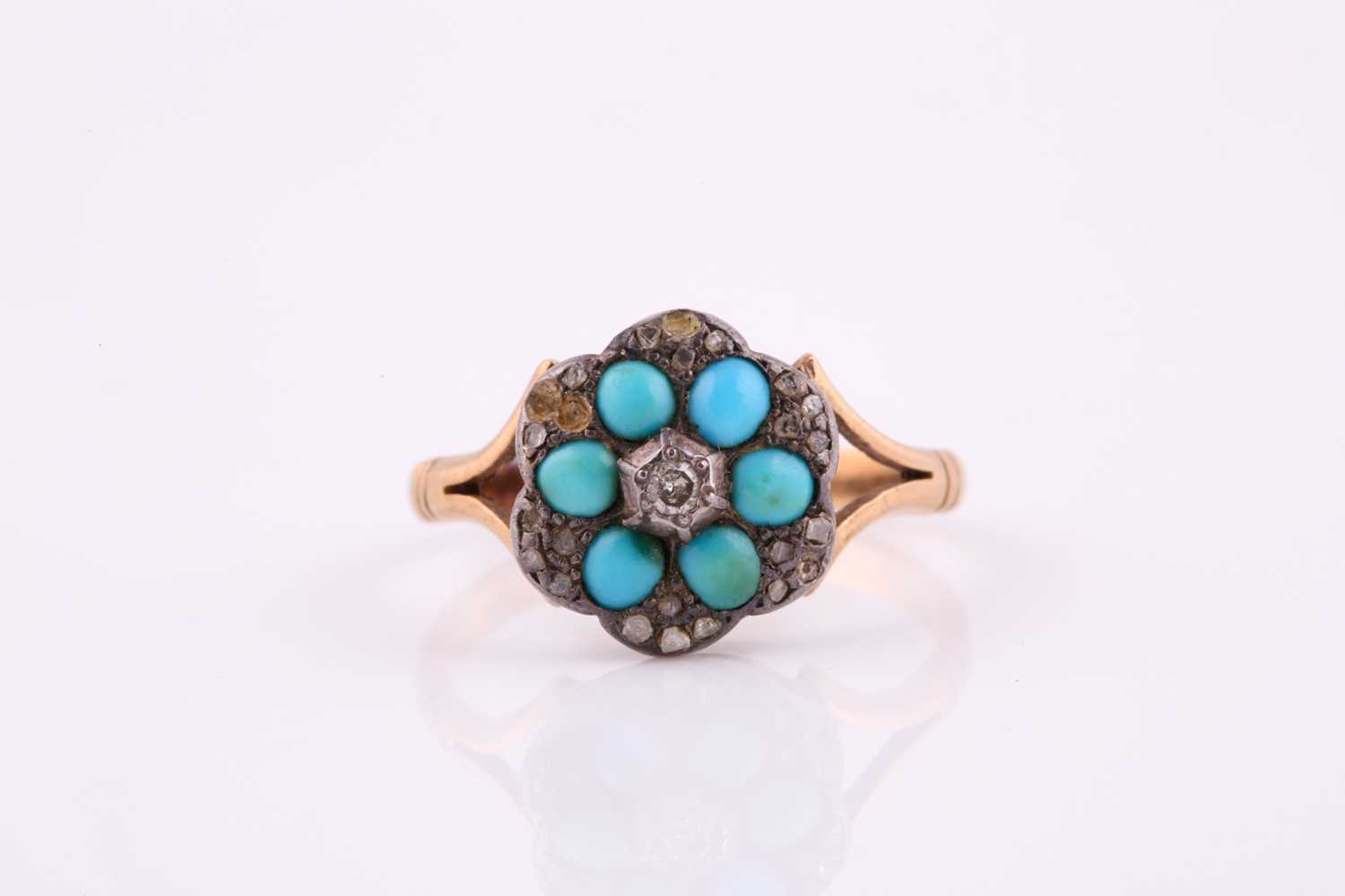 A late 19th century turquoise and diamond flower head ring, the central diamond surounded by six