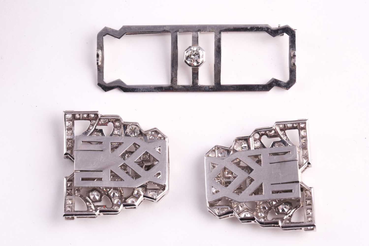 An Art Deco diamond lapel brooch, the large rectangular openwork mount centred by a collet set round - Image 5 of 5