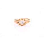 An 18ct gold ring set with an old-cut diamond, approximately 0.56cts, the split tapering shoulders