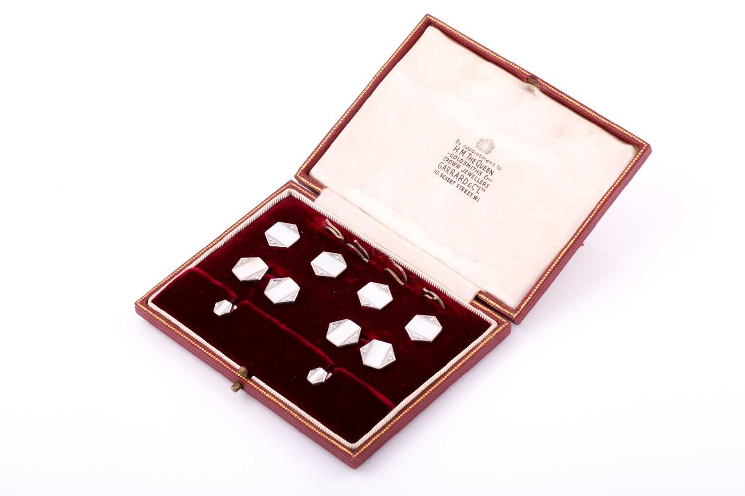 A beautifully presented Garrard and Co suite of cufflinks and shirts studs inlaid with Mother of