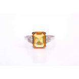 A yellow sapphire and diamond ring, the 10.5x8mm yellow sapphire with an estimated weight of 3.20ct,