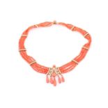 A Victorain French coral & pearl necklace, consisting of four rows of graduating dark orange coral