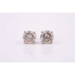 A pair of diamond stud earrings, the 4-claw set brilliant cut diamonds combined approximately 3.97ct