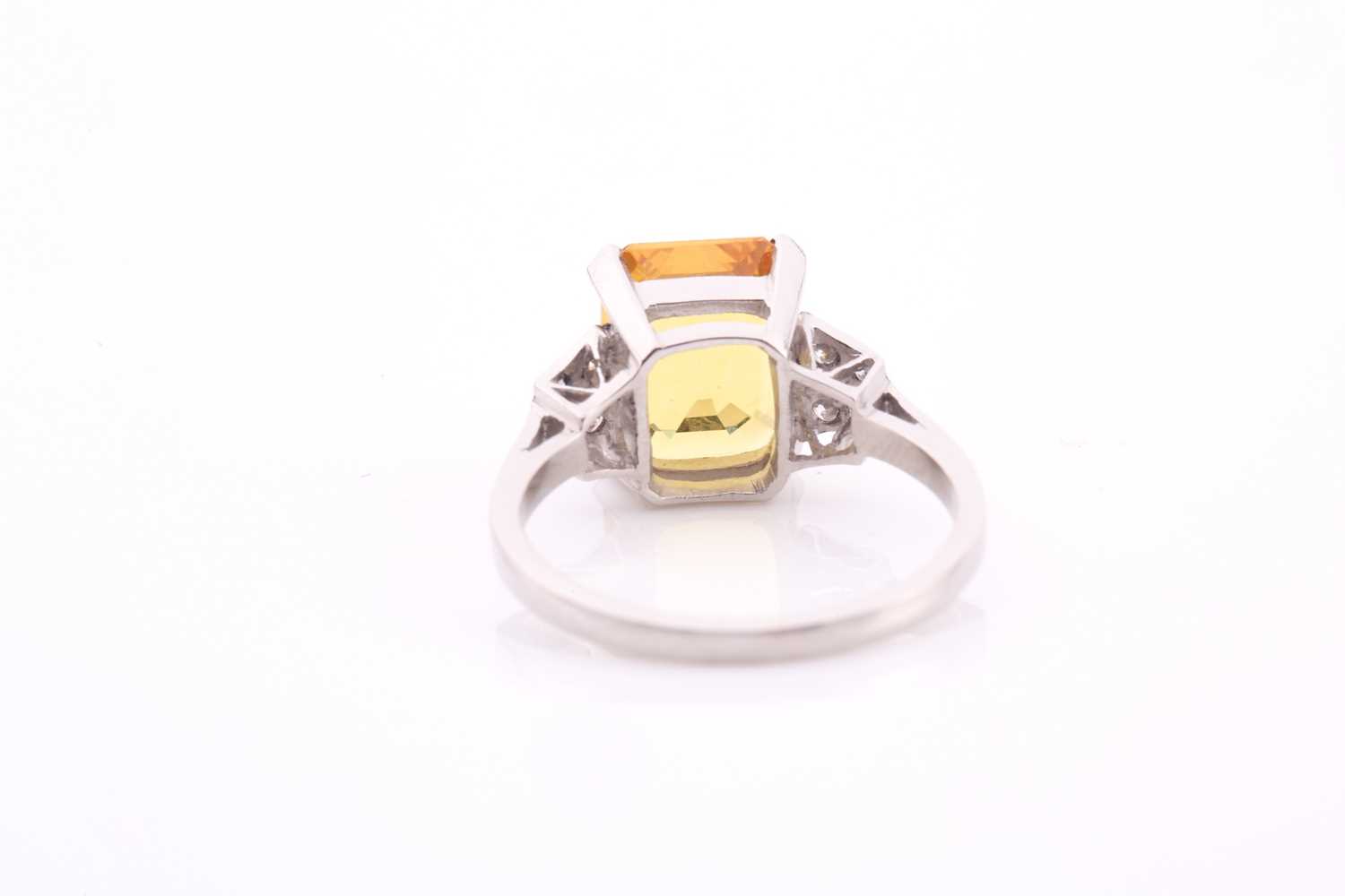 A yellow sapphire and diamond ring, the 10.5x8mm yellow sapphire with an estimated weight of 3.20ct, - Image 3 of 4