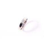 A platinum diamond solitaire ring, set with a round brilliant cut diamond of an estimated weight