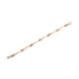 An 18ct yellow gold triple bar bracelet, the clasp stamped .750. 20 cm long. Condition report: 19.