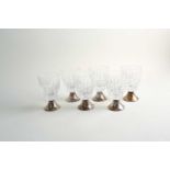 A set of six Mappin and Webb glasses, each on a silver flared foot with import hallmarks, 12cm