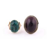 Two rings, comprising an early 20th century gold and green faience scarab beetle collet later