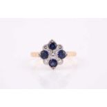 A sapphire and diamond panel ring,the four corner sapphires with five main diamond divisions and