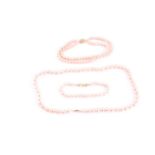 A lot consisting of a pearl necklace and two bracelets, the necklace comprises of a knotted string