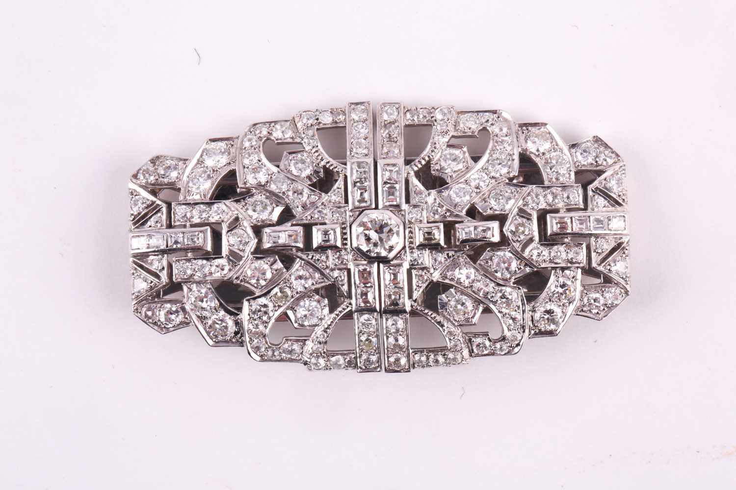 An Art Deco diamond lapel brooch, the large rectangular openwork mount centred by a collet set round - Image 3 of 5