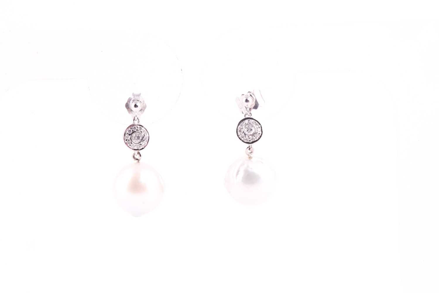 A pair of diamond and pearl drop earrings, set with South Sea pearls, approximately 10.5 mm