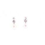 A pair of diamond and pearl drop earrings, set with South Sea pearls, approximately 10.5 mm