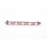 An early 20th century pearl and diamond bar brooch, the five untested pearls each approximately