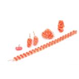 A lot consisting of a three-row bracelet set with oval cabochon coral stones measuring 19cm in