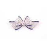 An Art Deco sapphire and diamond bow brooch, with a central old-cut diamond approximately 0.65cts,