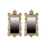 A pair of 'Chinese Chippendale' style carved, pierced wood and gilt gesso wall mirrors, 20th
