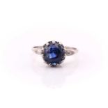 A white metal ring set with a cushion-cut 5.18ct Sri Lankan (Ceylon) natural blue sapphire measuring
