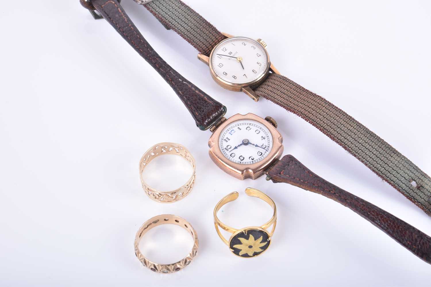 A ladies rose gold cocktail wristwatch on brown leather strap, together with a yellow metal ladies