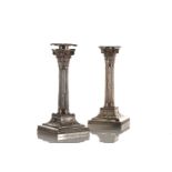 A pair of Victorian silver Corinthian column candlesticks, the detachable scones with beaded