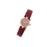 A quartz 24mm Must De Cartier gold plated silver lady's wristwatch with red dial and leather strap.