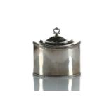 An Edwardian silver tea caddy, of oval form, the hinged domed cover with cast "C" scroll swing