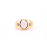 An 18ct yellow gold gypsy ring set with an oval cabochon opal, approximately 10mm x 8.2mm, flanked
