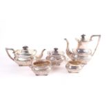 A silver four piece tea service, of boat form, the tea and coffee pot with reeded rectangular