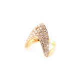 A diamond dress ring; the wishbone shaped centre, pavé set with round brilliant cut diamonds to a