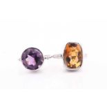 An amethyst and diamond ring, the round mixed cut amethyst collet set in white metal with a round