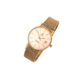 A gentleman's 9 carat gold Tissot Automatic Seastar seven wristwatch; the circular champagne dial