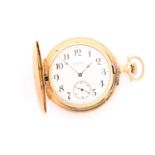 A yellow metal yellow stamped 14kt engraved double hunter case pocket watch with an L. A Peck Merced