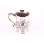 A Victorian silver mug. London 1859 by John Bell & Frederick Brasted. The heavy baluster form with