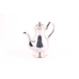 A Victorian silver hot water pot, London 1845 by Charles Thomas Fox & George Fox. With melon