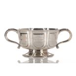 An Edwardian silver twin-handled bowl by William Comyns & Sons, of lobed form with vacant