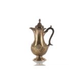 A Victorian silver hot water jug, the repousse reeded cover with fluted knop finial and beaded