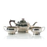 A Cooper Brothers and Sons Ltd silver three piece tea service of canted rectangular form, the tea