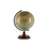 A Bacon's Excelsior Terrestrial table globe, 12" model, on turned wooden stand, 45 cm high.