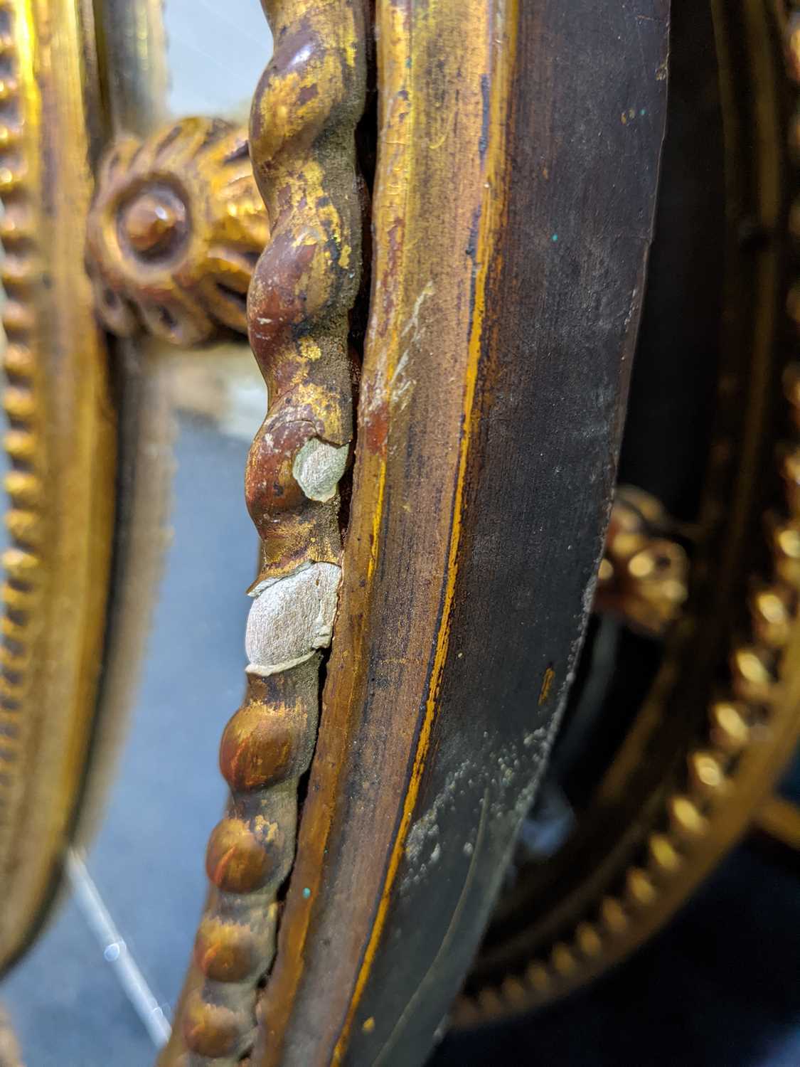 A pair of George III Adam style gilt framed oval mirrors, 20th century, with moulded paterae between - Image 2 of 5