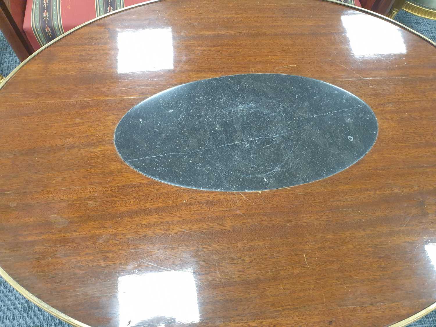 An Empire-style ormolu mounted mahogany oval center table, possibly Spanish first quarter of the - Image 3 of 9