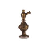 An Eastern brass "Shisha" water pipe base with studded and applied diamond boss decoration to the