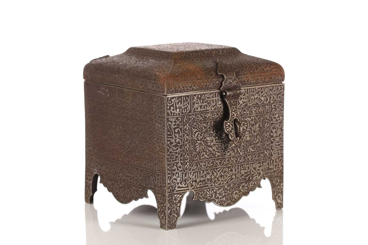 An Indo-Persian style steel box with moulded, hinged caddy top bearing intricate engraved Islamic