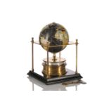 A Royal Geographic Society World clock with rotating terrestrial globe within a gilt metal chassis
